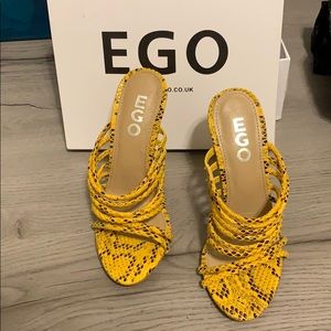 Never worn brand new yellow snake skin heels...